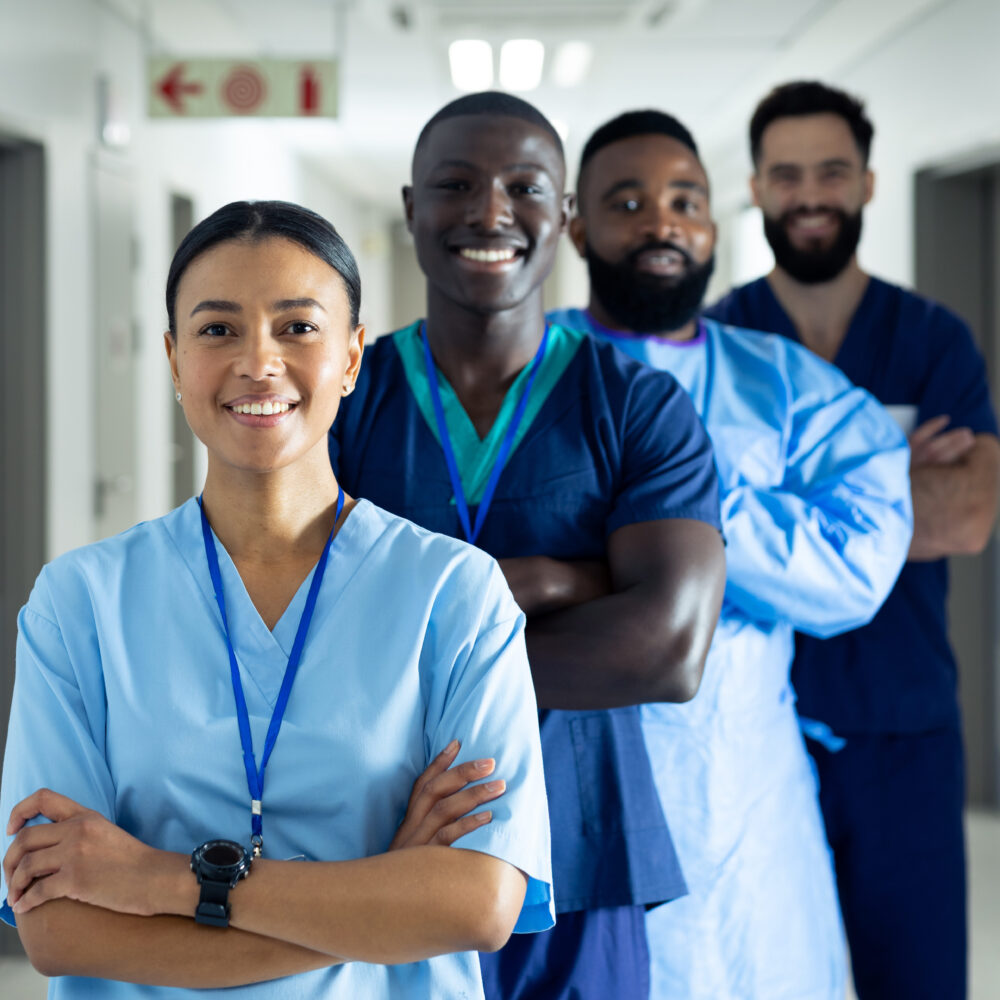 Vertical portrait of diverse group of smiling healthcare workers